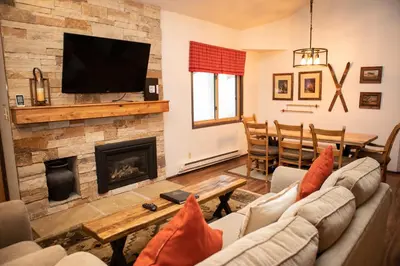 a living room with a couch and a fireplace at 1168 Flying Dutchman condo in Keystone