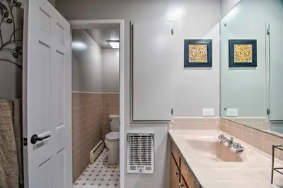 a bathroom with a sink and a toilet at Chic Boulder Mountain Home with Hot Tub and Views in Boulder