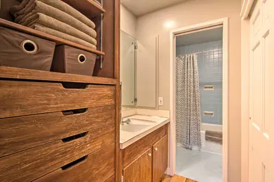 a bathroom with a sink and a bath tub at Chic Boulder Mountain Home with Hot Tub and Views in Boulder