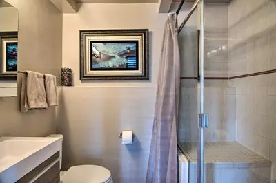 a bathroom with a shower and a toilet at Chic Boulder Mountain Home with Hot Tub and Views in Boulder