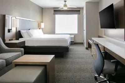 a hotel room with a bed and a tv at Homewood Suites By Hilton Dillon in Dillon