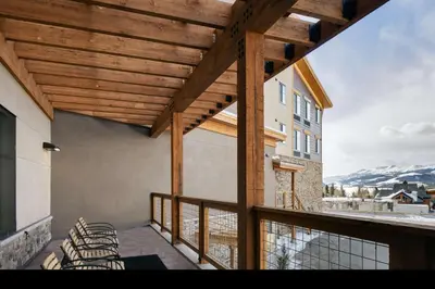 a balcony with chairs and a view of a mountain at Homewood Suites By Hilton Dillon in Dillon