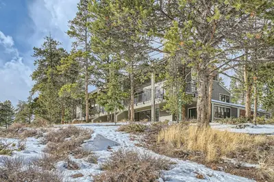 a house in the woods in the snow at 2084 The Pines condo in Keystone
