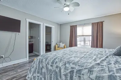 a bedroom with a bed and a ceiling fan at Modern Townhome near Old Town, Breweries, & River! in Fort Collins
