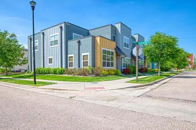 a building on the corner of a street at Modern Townhome near Old Town, Breweries, & River! in Fort Collins