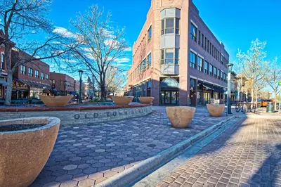 a cobblestone street in front of a building at Modern Townhome near Old Town, Breweries, & River! in Fort Collins
