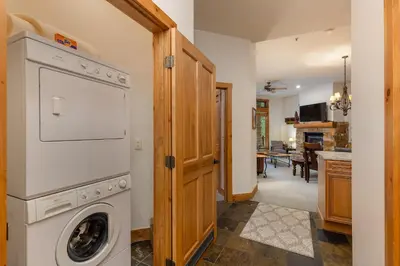 a laundry room with a washer and dryer at 3059 The Timbers condo in Keystone
