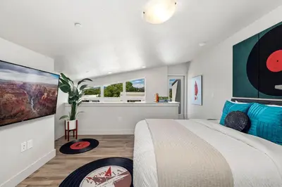 a bedroom with a large bed and a window at Old Town Swank - Brand New To Brewery District! in Fort Collins