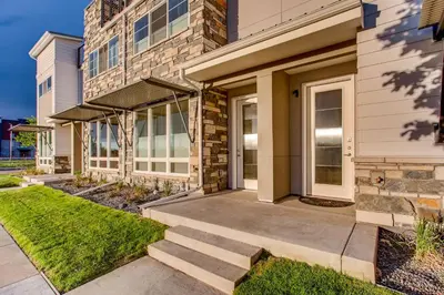 a home with a pathway leading to the front door at Old Town Swank - Brand New To Brewery District! in Fort Collins