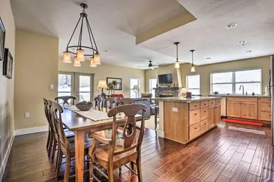 a kitchen and dining room with a table and chairs at Ski-InandSki-Out Granby Base Camp Escape with Balcony in Granby