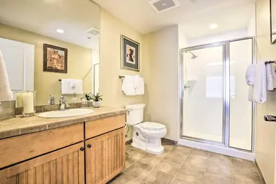 a bathroom with a toilet sink and a shower at Ski-InandSki-Out Granby Base Camp Escape with Balcony in Granby
