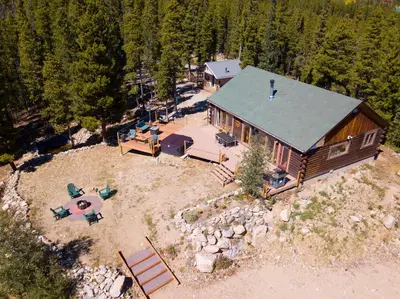 an aerial view of a log cabin with a backyard at 2 Mi to St Marys Glacier Modern Cabin with Hot Tub in Idaho Springs