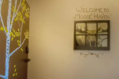 a room with a window with a welcome to moose haven at Snowblaze Condos Building C unit 24 in Winter Park
