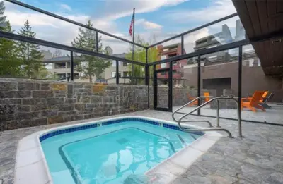 a swimming pool in a house with a building at Snowblaze Condos Building C unit 24 in Winter Park
