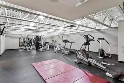 a gym with several treadmills and cardio machines at Snowblaze Condos Building C unit 24 in Winter Park