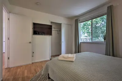 a bedroom with a bed with a television on the wall at Spacious Thornton Home 15 Mi to Downtown Denver! in Thornton