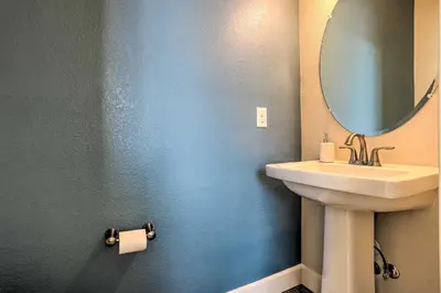 a bathroom with a sink and a mirror at Modern Aurora Getaway 22 Mi to Downtown Denver in Watkins