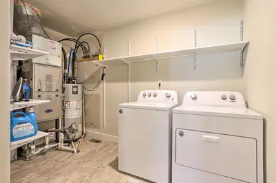 a laundry room with a washer and dryer at Modern Aurora Getaway 22 Mi to Downtown Denver in Watkins