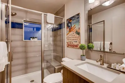 a bathroom with a sink and a toilet and a shower at Elegant Townhome near Old Town, Breweries and River! in Fort Collins