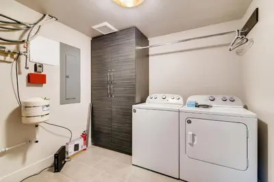 a laundry room with a washer and dryer at Fancy Townhome near Old Town, Breweries and River! in Fort Collins