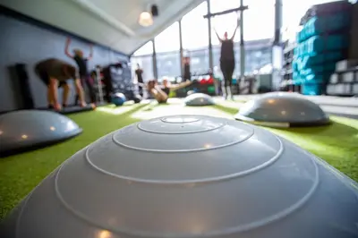a group of people doing yoga in a room at Gravity Haus Winter Park in Winter Park