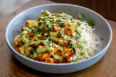 a bowl of food with rice and vegetables at Gravity Haus Winter Park in Winter Park