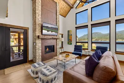 a living room with a couch and a fireplace at Anglers Paradise - Located on Lake Estes, Fireplace, Two Large Patios, and Private Jacuzzi in Estes Park