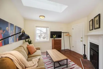 a living room with a couch and a fireplace at Boulder Guest House in Boulder