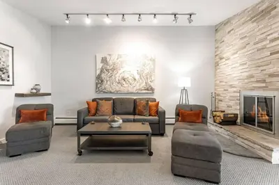 a living room with two couches and a fireplace at Lake Cliffe E-305 - Dillon in Dillon