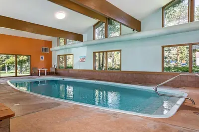 a swimming pool in a house with windows at Lake Cliffe E-305 - Dillon in Dillon