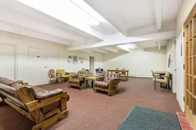 a waiting room with couches and tables and chairs at Lakeview A-303 - Dillon in Dillon