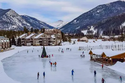 a group of people skiing on a ski slope in the snow at Lakeview A-303 - Dillon in Dillon