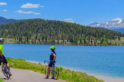 two people riding bikes on a path near a lake at Snowscape 06 - Wildernest in Silverthorne
