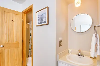 a bathroom with a sink and a mirror at 11 Mi to Keystone Resort Condo in Silverthorne in Silverthorne