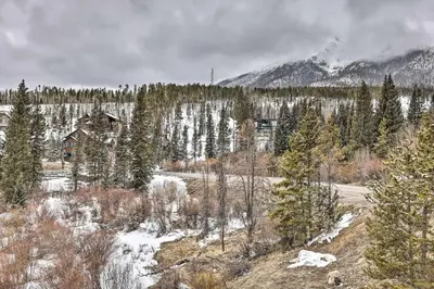 a house in the middle of a snow covered forest at 11 Mi to Keystone Resort Condo in Silverthorne in Silverthorne