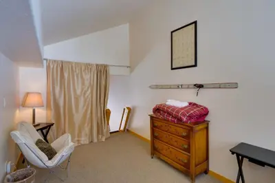 a room with a dresser and a chair and a desk at Slopeside Sanctuary - Penthouse Less Than 1 Mi to Lifts! in Winter Park