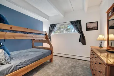 a bedroom with a bunk bed and a window at Ten Mile Creek 304 condo in Frisco