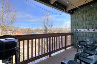 a porch with two chairs and a balcony with a view at Ten Mile Creek 304 condo in Frisco