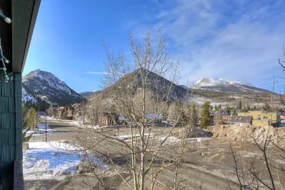 a view of a town with snow covered mountains at Ten Mile Creek 304 condo in Frisco