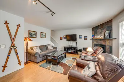 a living room with a couch and a fireplace at 3 Mi to Winter Park Resort Cozy Ski Condo in Winter Park