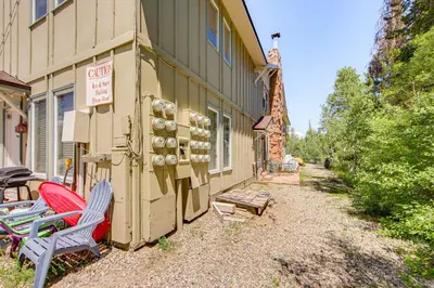 a building with two chairs sitting outside of it at 3 Mi to Winter Park Resort Cozy Ski Condo in Winter Park