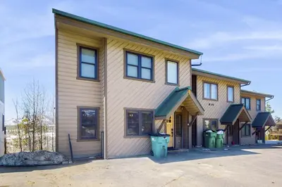 a house with two windows and two trash cans at Modern Fraser Mountain Home in Fraser