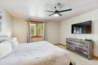 a bedroom with a bed and a ceiling fan at Mountain Retreat on 1st in Frisco