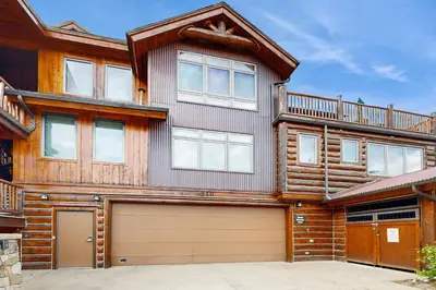 a large wooden house with a garage at Mountain Retreat on 1st in Frisco