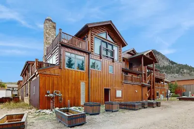a large wooden house in the mountains at Mountain Retreat on 1st in Frisco