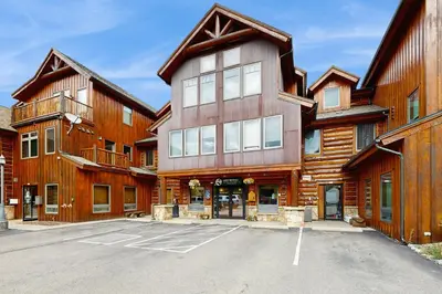 a parking lot in front of a building at Mountain Retreat on 1st in Frisco