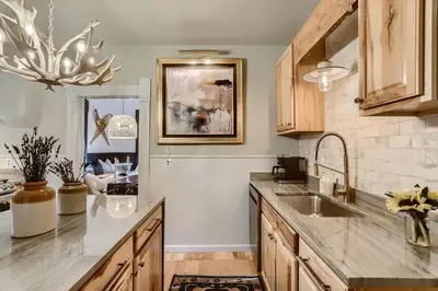 a kitchen with a sink and a counter at A-Lodge Lyons in Lyons