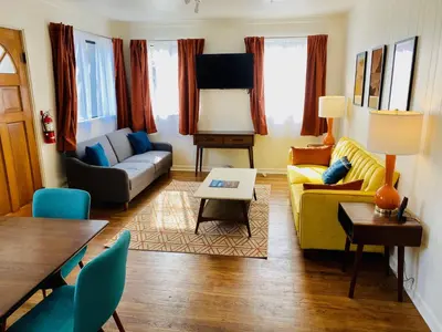 a living room with a couch and a table at A-Lodge Lyons in Lyons