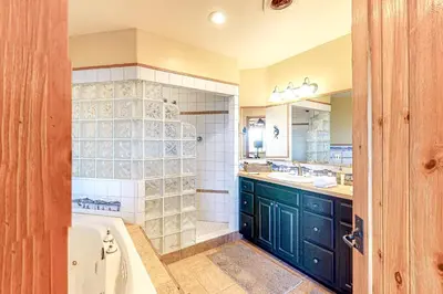 a bathroom with a bath tub and a sink at Dillon Dreamscape in Dillon