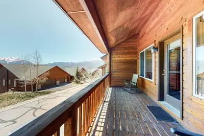 a wooden balcony with a view of the mountains at Dillon Dreamscape in Dillon